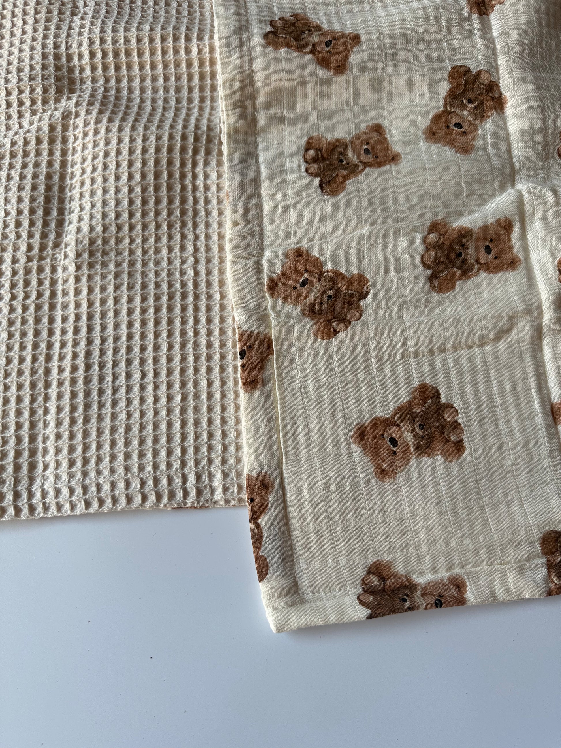 Bear print waffle blanket laid out on a white background